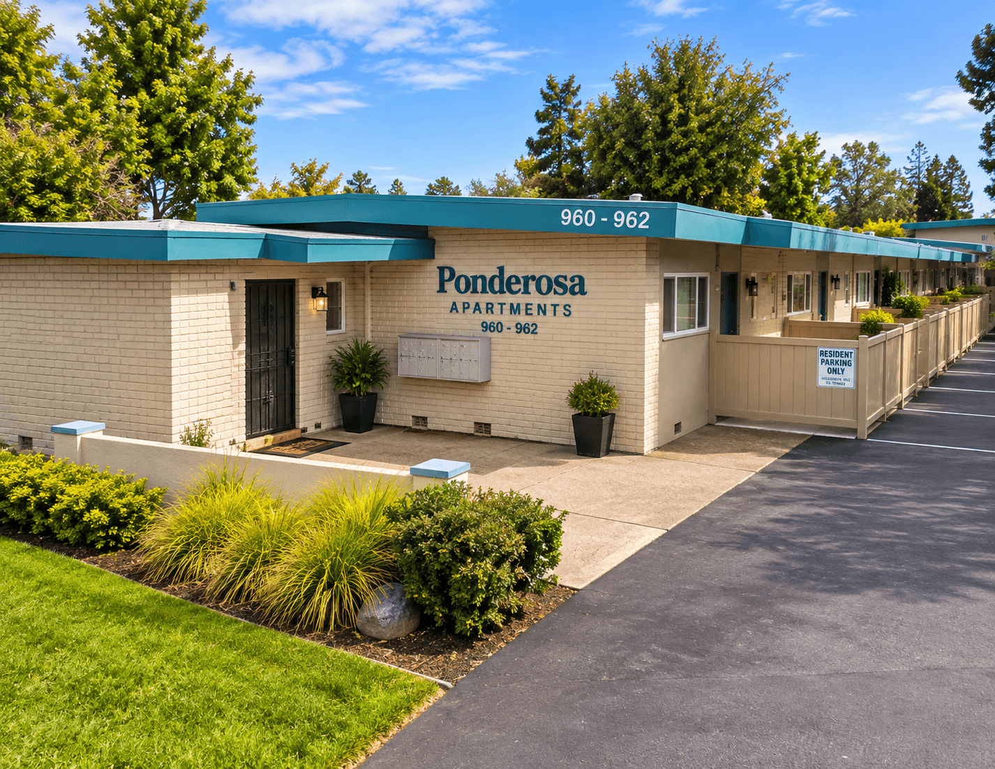 Ponderosa Apartments entrance and private patios beside assigned parking