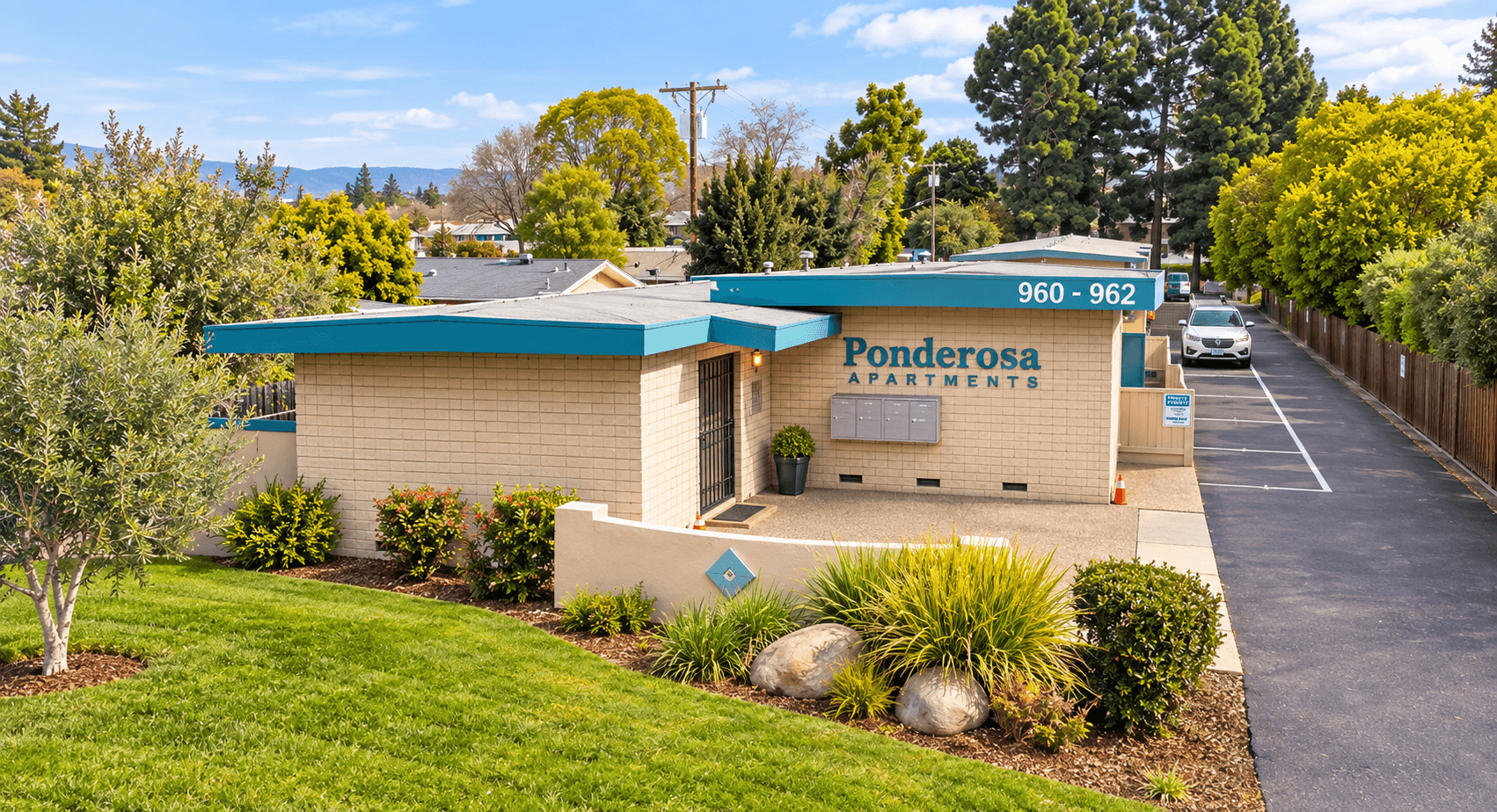 Landscaped entrance to Ponderosa Apartments at 960–962 W Weddell Drive