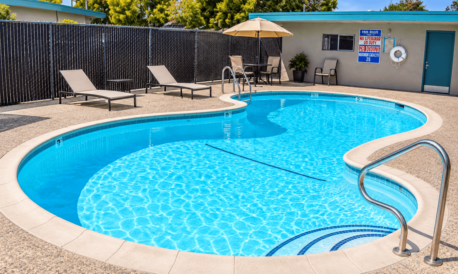 Sunnyvale Greenbelt community pool with loungers and a shaded table